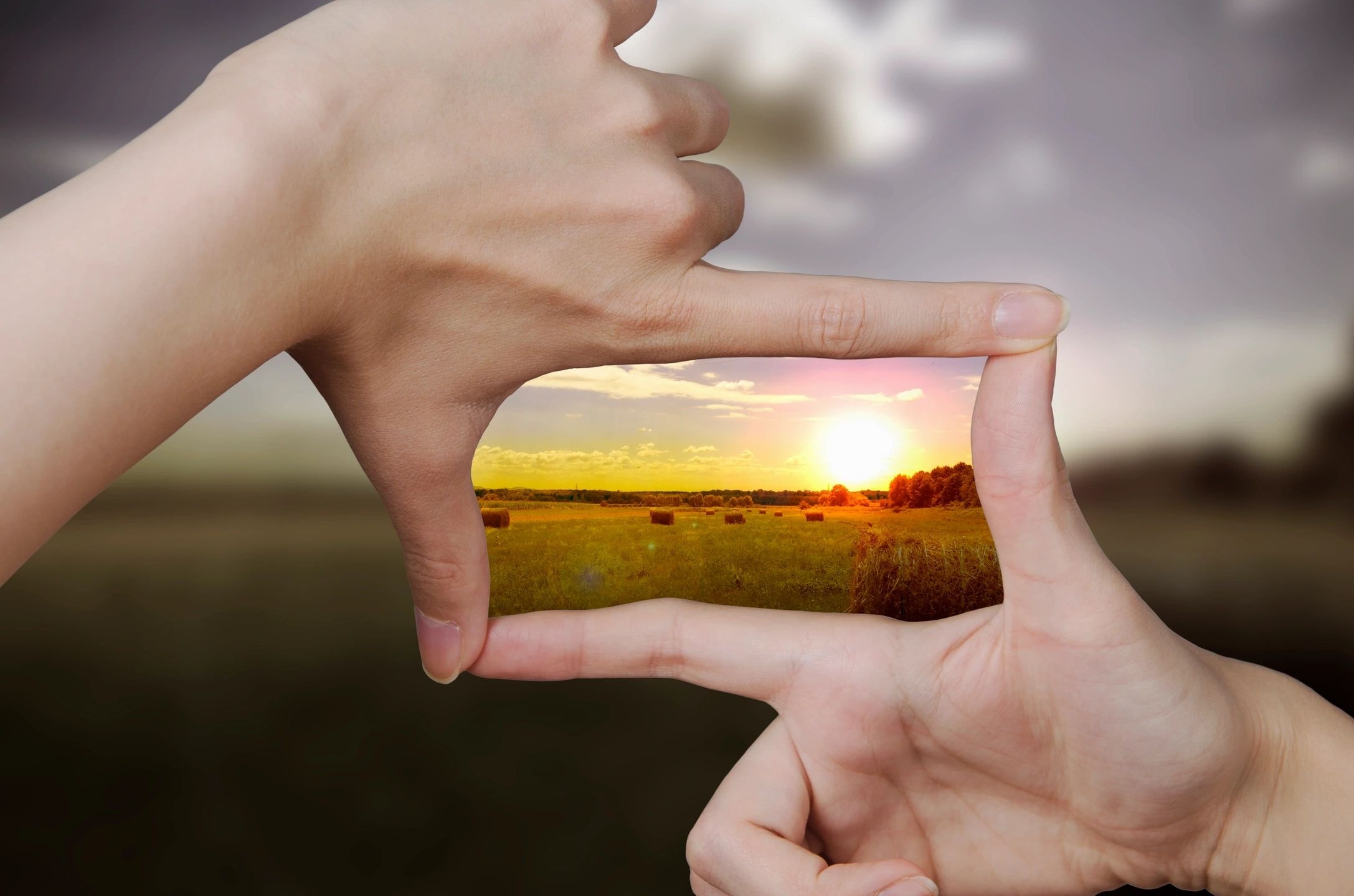 Hands framing a horizon — Our Vision